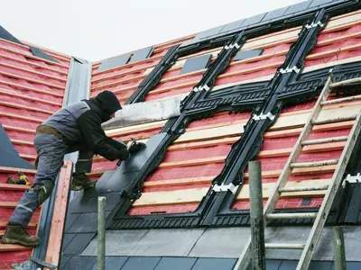 Remplacement de tuiles sur une toiture